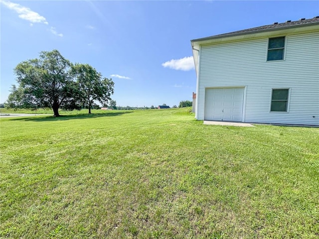 view of yard with a garage