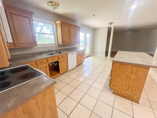 kitchen featuring a center island, sink, dishwasher, and a wealth of natural light