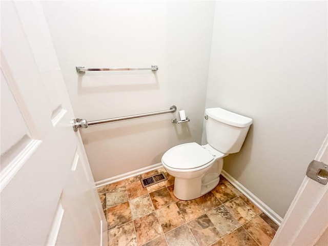 bathroom with tile floors and toilet