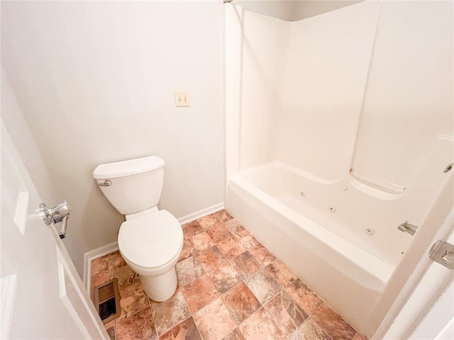 bathroom with tile floors, tub / shower combination, and toilet