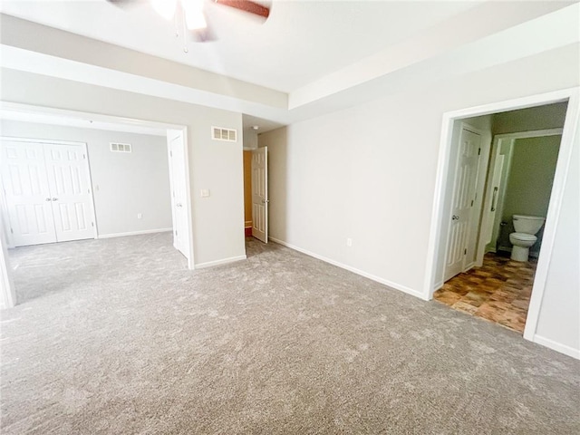 unfurnished room featuring carpet and ceiling fan