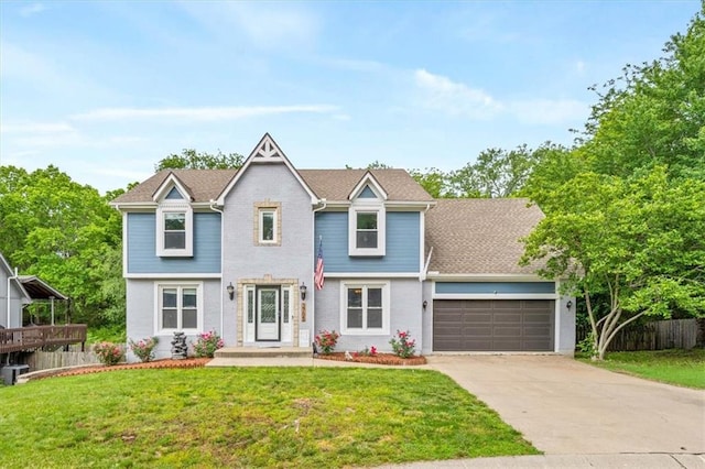 view of front of house with a garage and a front lawn