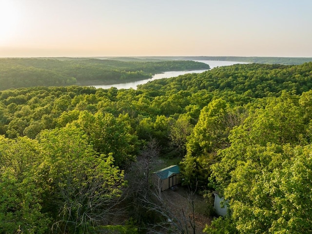 aerial view at dusk with a water view