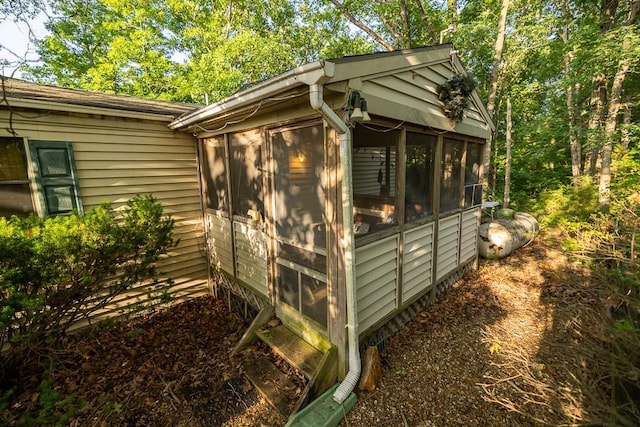 view of side of home with a sunroom