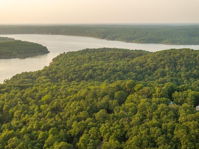 aerial view at dusk with a water view