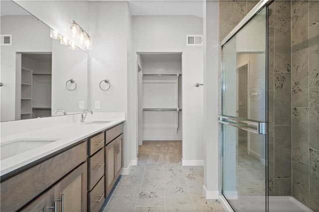 bathroom with vanity, tile patterned floors, and an enclosed shower