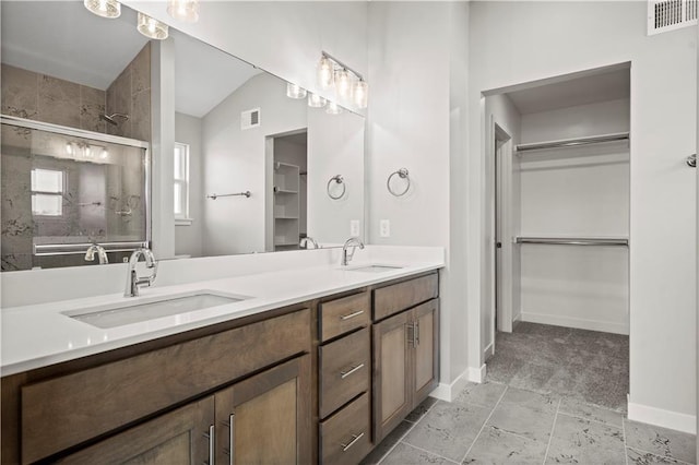 bathroom featuring vanity, an enclosed shower, and lofted ceiling