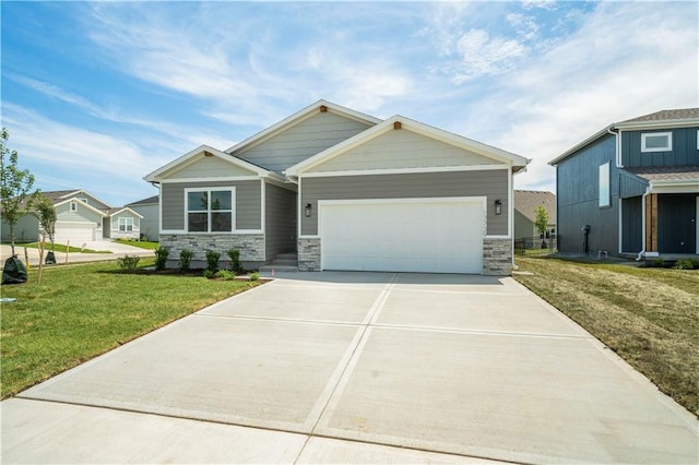 view of front of home with a garage and a front lawn