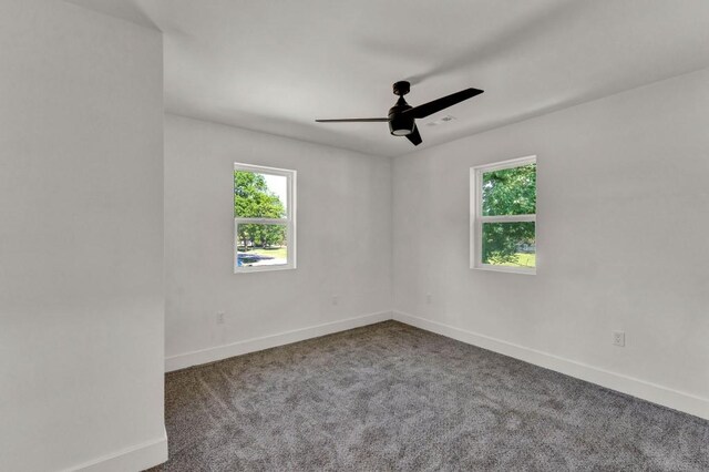 unfurnished room with ceiling fan and carpet floors