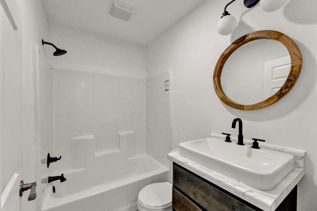 full bathroom featuring oversized vanity, toilet, and shower / bathtub combination