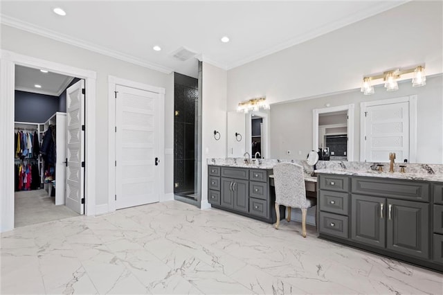 bathroom with vanity, an enclosed shower, and ornamental molding