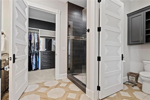 bathroom featuring toilet and walk in shower