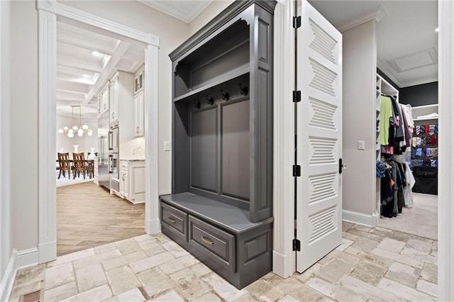 mudroom featuring beam ceiling, crown molding, light hardwood / wood-style flooring, and coffered ceiling