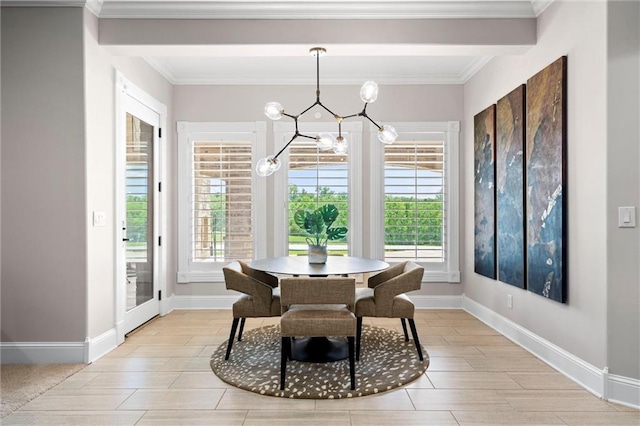 dining area with crown molding, a healthy amount of sunlight, and a notable chandelier