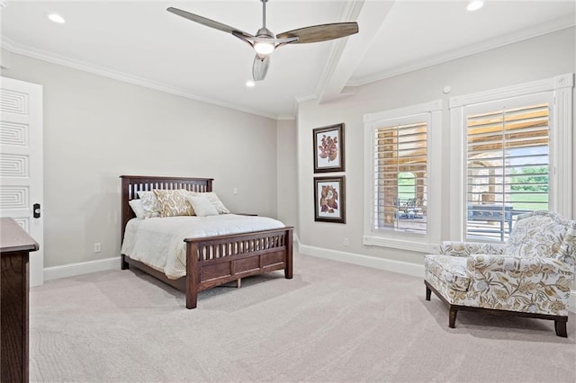 carpeted bedroom featuring ceiling fan and crown molding