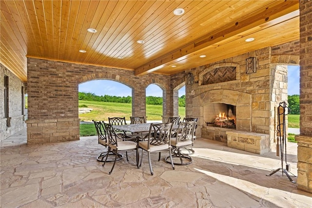 view of patio / terrace with an outdoor stone fireplace