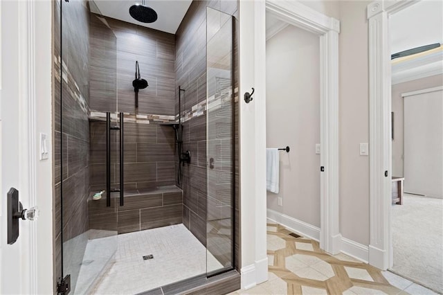 full bath with a shower stall, baseboards, and tile patterned floors