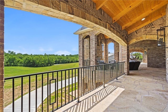 view of patio featuring a balcony