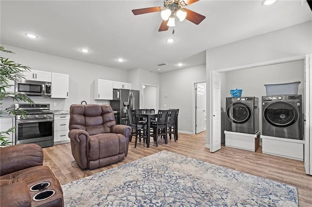 living area featuring baseboards, ceiling fan, independent washer and dryer, light wood-style floors, and recessed lighting