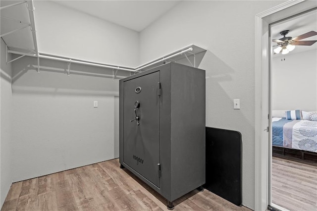 spacious closet featuring a ceiling fan and wood finished floors