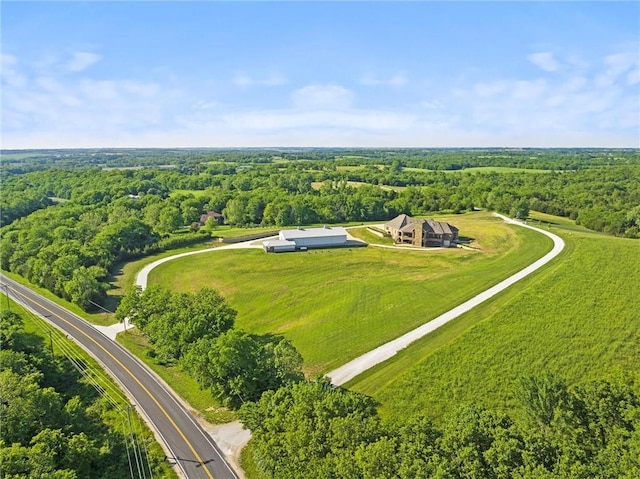 aerial view featuring a view of trees