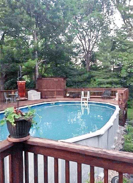 view of pool featuring a wooden deck