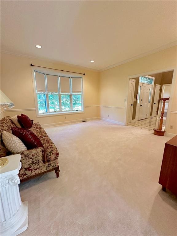 living area with crown molding and carpet floors