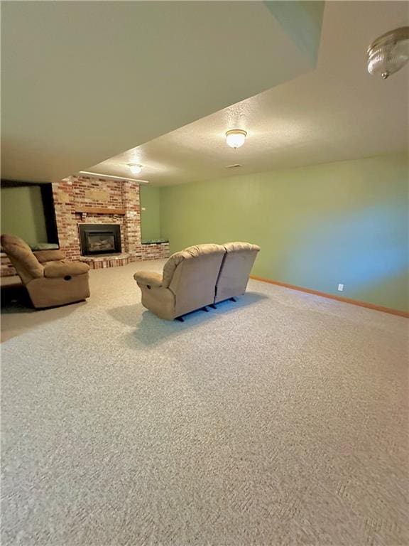 carpeted living room with brick wall and a fireplace