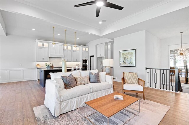 24932 W 98th Pl, Lenexa, KS 66227 - living room featuring light wood-type flooring, a ceiling fan, a chandelier, recessed lighting, and ornamental molding
