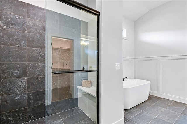 24932 W 98th Pl, Lenexa, KS 66227 - full bath with a decorative wall, a shower stall, a freestanding bath, vaulted ceiling, and a wainscoted wall