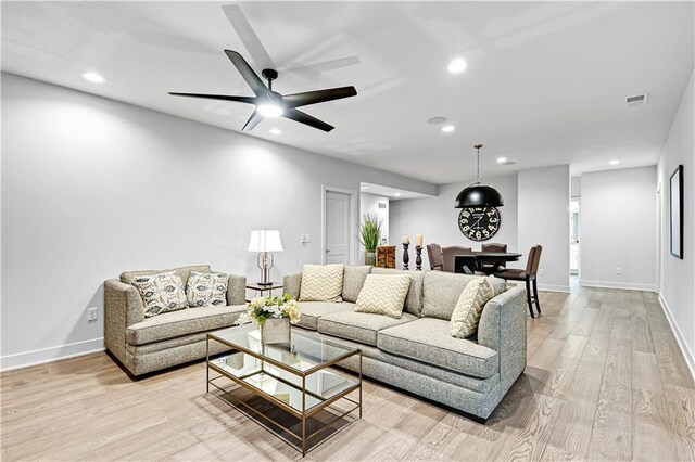 24932 W 98th Pl, Lenexa, KS 66227 - living room featuring light wood finished floors, recessed lighting, baseboards, and a ceiling fan