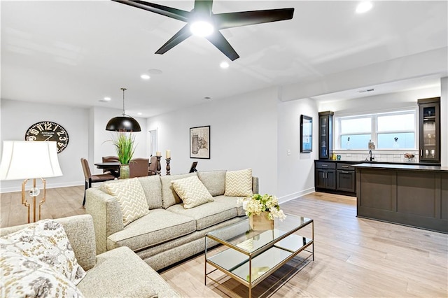24932 W 98th Pl, Lenexa, KS 66227 - living room with recessed lighting, light wood-style flooring, baseboards, and ceiling fan