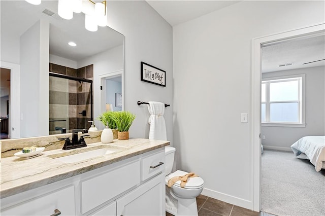 24932 W 98th Pl, Lenexa, KS 66227 - ensuite bathroom with a stall shower, baseboards, toilet, tile patterned floors, and vanity