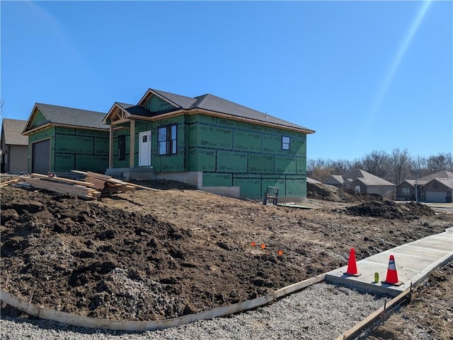 view of side of property with an attached garage