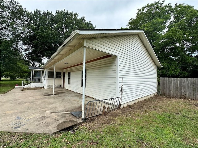321 Pecan St, Chetopa, KS 67336 - view of property exterior with a patio and a carport