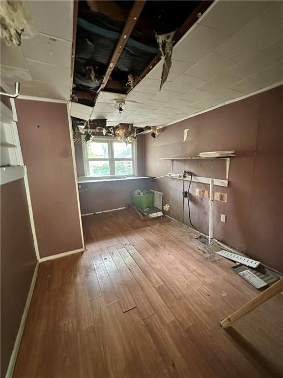 321 Pecan St, Chetopa, KS 67336 - below grade area with wood finished floors