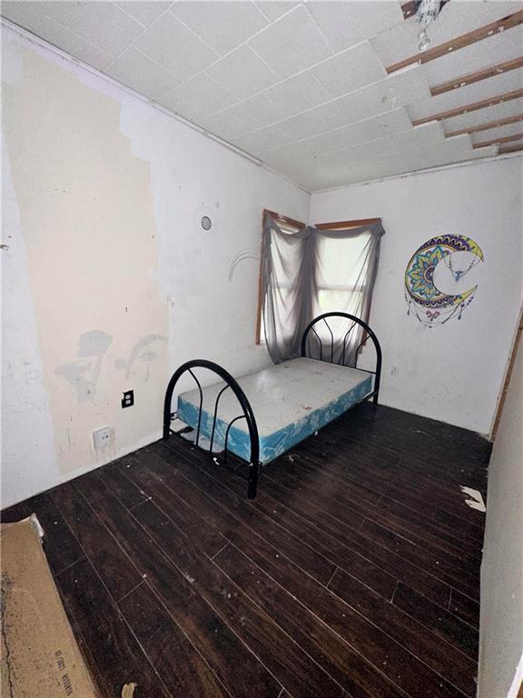 321 Pecan St, Chetopa, KS 67336 - bedroom featuring hardwood / wood-style floors