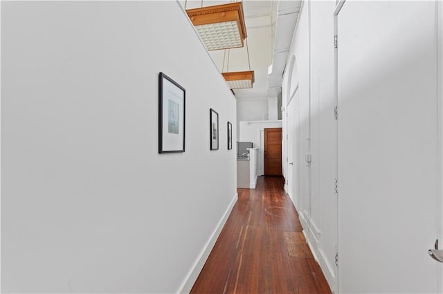 hallway featuring dark hardwood / wood-style flooring