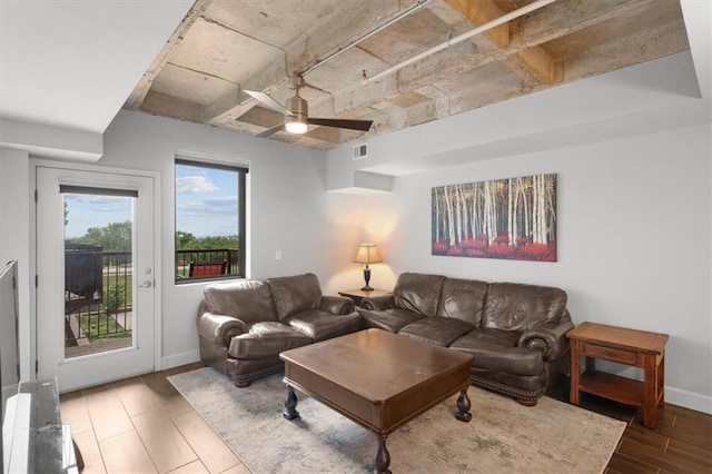 living room with hardwood / wood-style flooring and ceiling fan