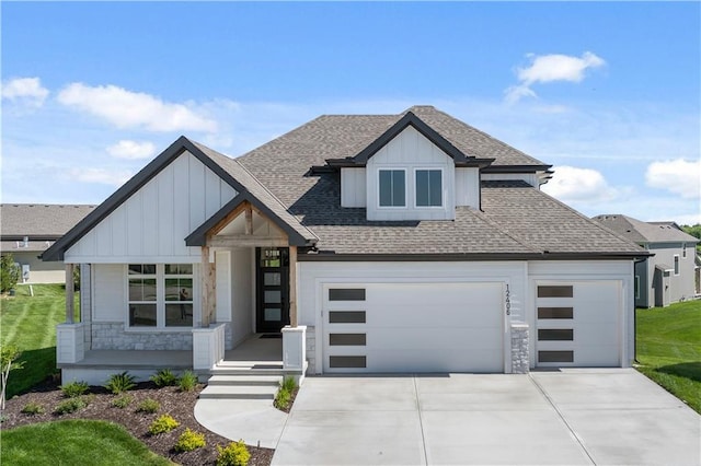 view of front of property with a garage and a front lawn