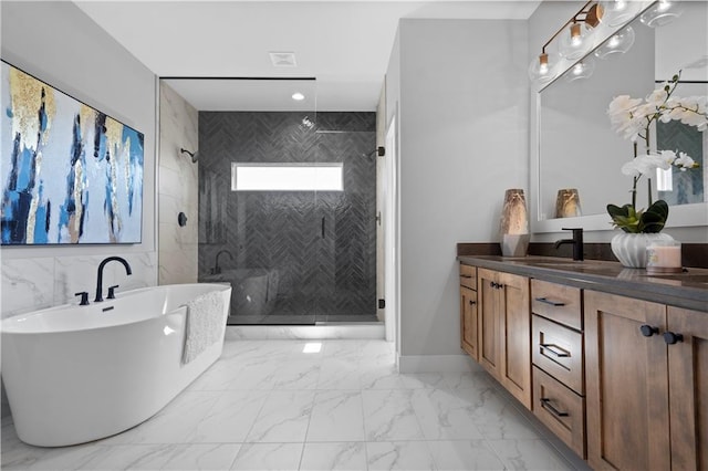 bathroom featuring a stall shower, a soaking tub, marble finish floor, vanity, and recessed lighting