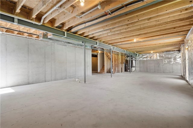 unfinished basement with stairway