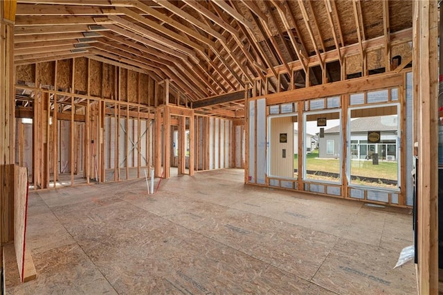 miscellaneous room featuring high vaulted ceiling