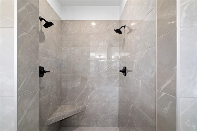 bathroom with tiled shower