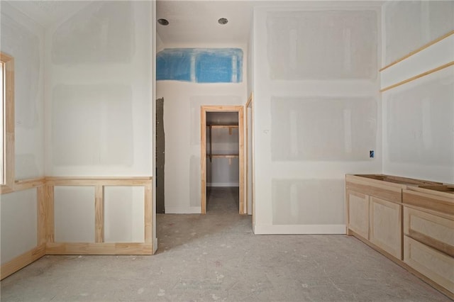 interior space featuring baseboards