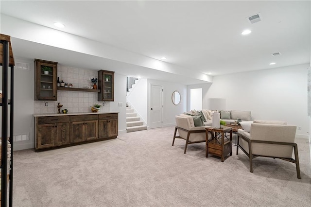 living room featuring stairway, light carpet, recessed lighting, and visible vents