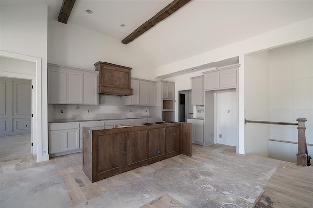 9346 Gander St, Lenexa, KS 66227 - kitchen with a kitchen island, high vaulted ceiling, beamed ceiling, and decorative backsplash