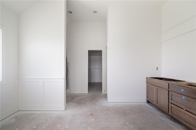 9346 Gander St, Lenexa, KS 66227 - bathroom featuring baseboards and a wainscoted wall