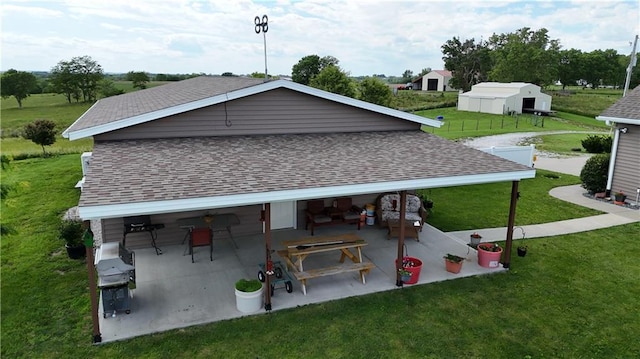 view of community with a patio area and a yard