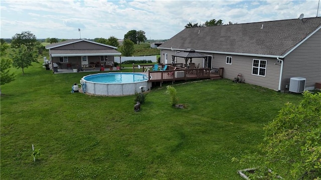 pool featuring a yard, cooling unit, and a gazebo